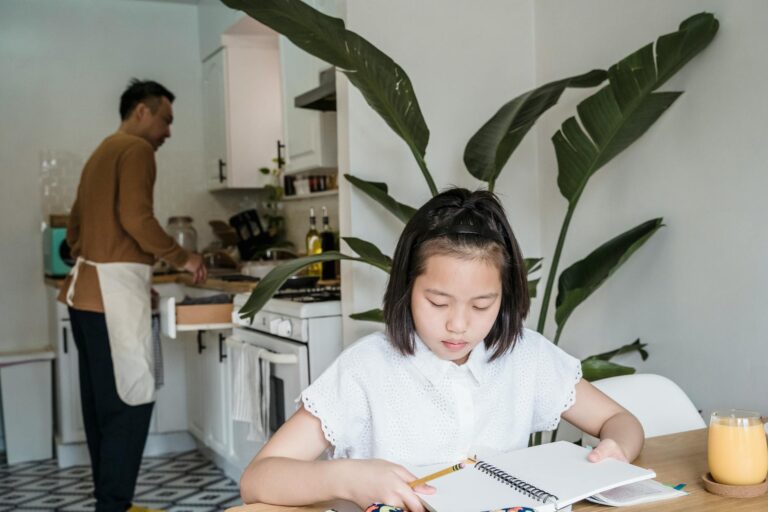 Family homework time kitchen table notebooks