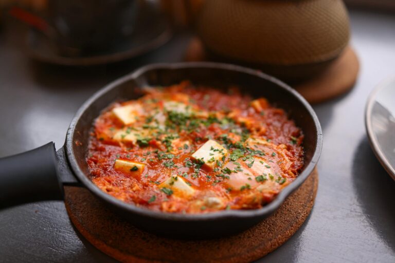 Egg skillet shakshuka tomatoes herbs