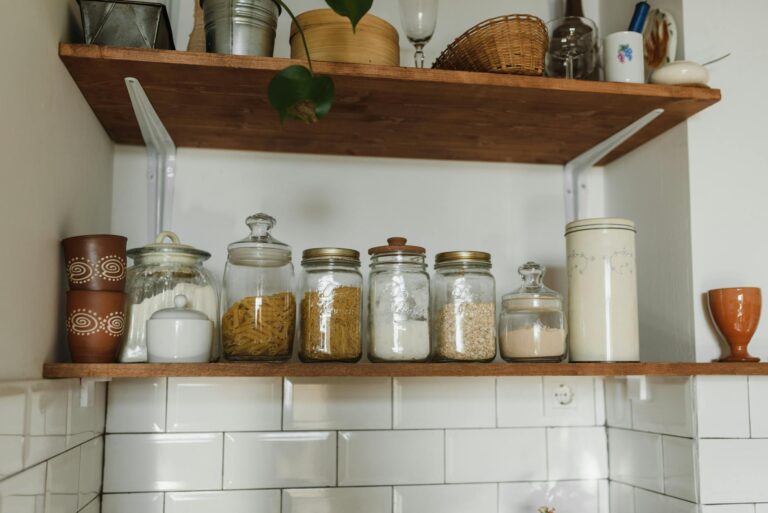 Organized fridge shelves glass containers vegetables detail