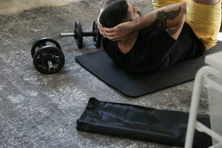 Athlete resting gym floor water bottle towel