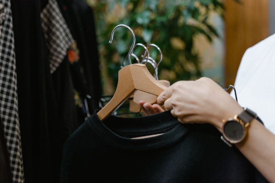 Person decluttering closet