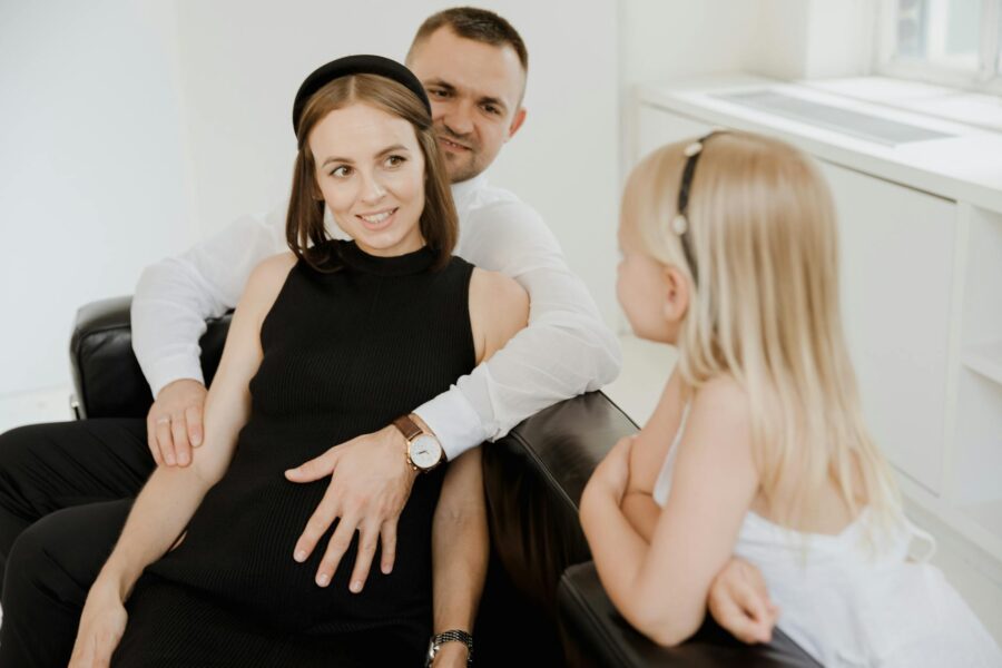Family sitting sofa talking together