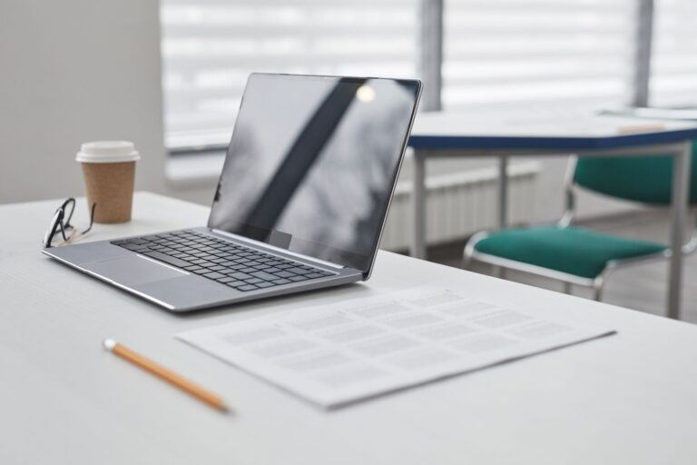 Desk paperwork laptop