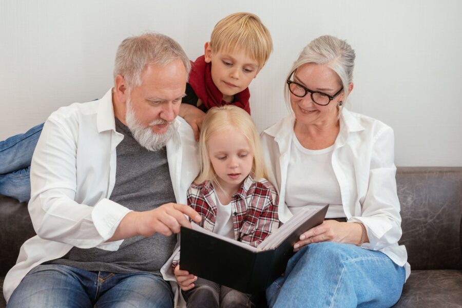 Grandparents sitting grandchildren