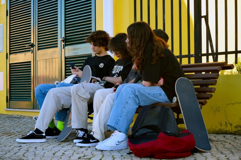 Teenagers sharing headphones