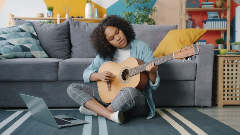 Woman practicing guitar