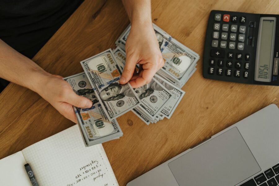 Person budgeting notebook