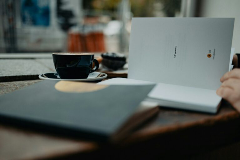 Person budgeting notebook